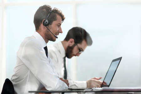 side view.consultants of the company sitting at the Desk