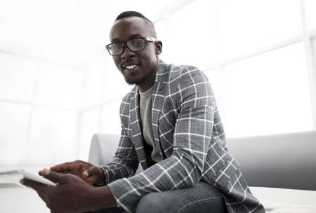 modern businessman sitting in office lobbyの写真素材