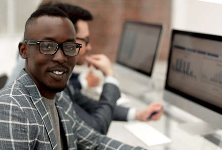 young employee sitting at the office Deskの写真素材