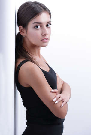 modern young woman leaning on wall