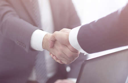 Confident businessman shaking handsの写真素材