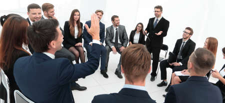 coach asks questions to the participants of the training.