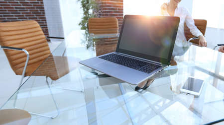 laptop and a smartphone on the desktop of a businessmanの写真素材
