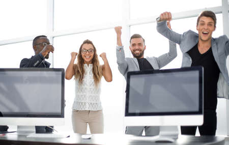 triumphant business team standing in the office