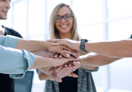 Business people teamwork stacking hands