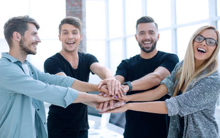 Business people joining hands in circle