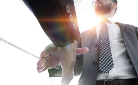 Two  business men going to make handshake