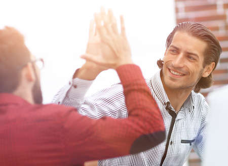 Businessman giving high five to his partner