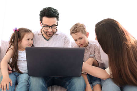 modern family looking at the laptop screen.の写真素材