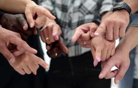 Hands of a group of unrecognizable circumcised young people