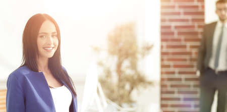 Face of beautiful woman on the background of business people