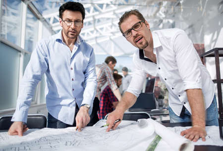 close up.professional designers standing at the workplace