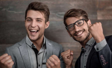 Best friends enjoying isolated over grey background.