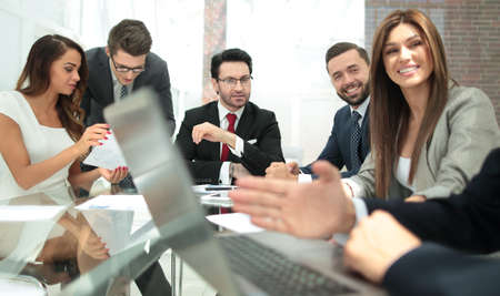 Businessman using laptop during a meeting of the Board of Directors