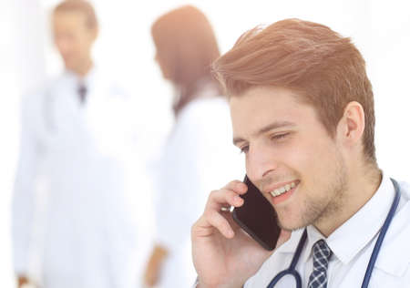 Dr. therapist is talking on the smartphoneの写真素材