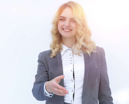 smiling business woman stretching hand for handshake.