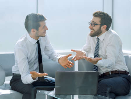 employees use a laptop to analyze business informationの写真素材