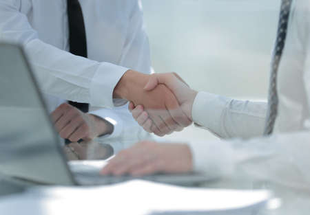close up.handshake business people at the Desk