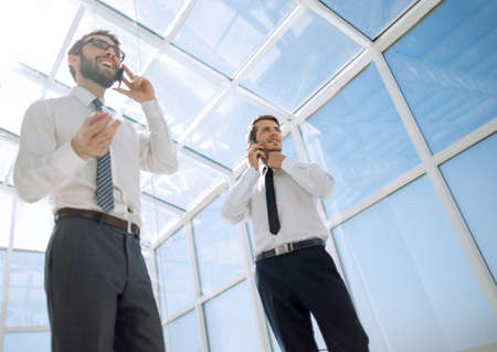 bottom view.business partners are talking on a mobile phone