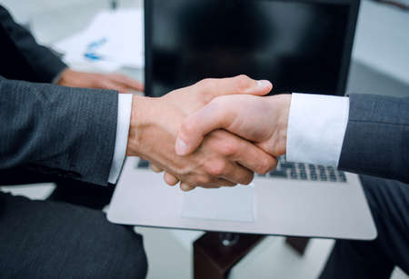 close up.handshake business partners over the Desk.の写真素材