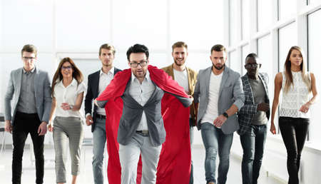businessman in a red cloak heads the business team