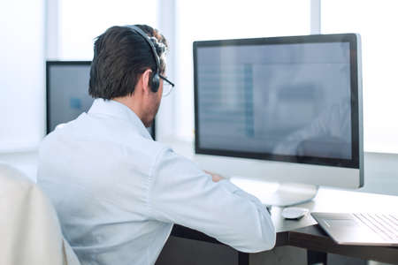 close up.businessman looking at the monitor of a modern computerの写真素材