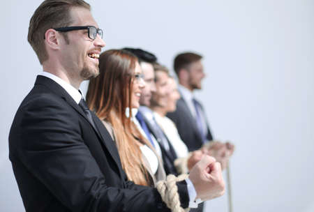 close up.a group of successful business people tied with one rope.