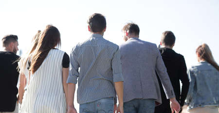 rear view . group of friends showing standing togetherの写真素材