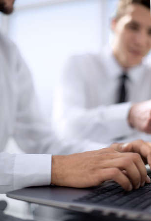 Close-up of laptop during typingの写真素材