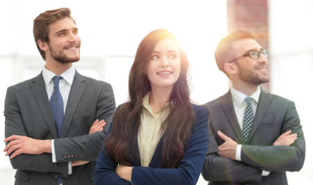 Smiling business team standing with arms crossed,の写真素材