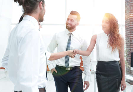 business women greet each other with a handshakeの写真素材