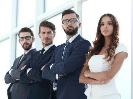 professional business team standing in a bright office