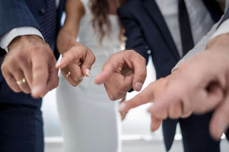 close up.a group of business youth pointing at youの写真素材