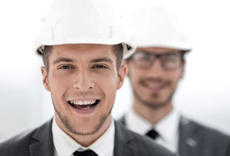 businessmen in hard hats close-upの写真素材