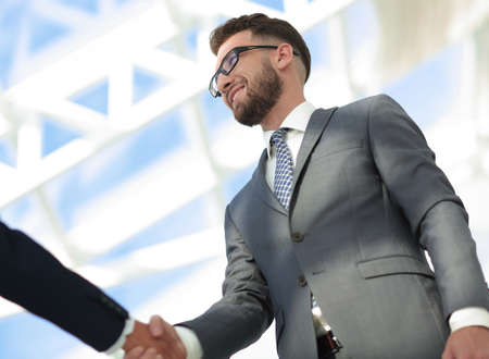 Young businessman shaking hands after agree to collaborate.