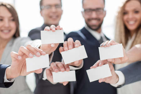 business cards in the hands of young entrepreneursの写真素材