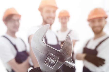 closeup. the wrench in the hands of the buildersの写真素材