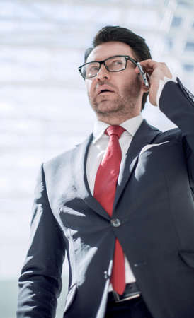 serious businessman talking on a smartphoneの写真素材