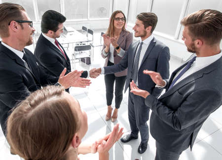 Businessman giving his hand for handshake to partner