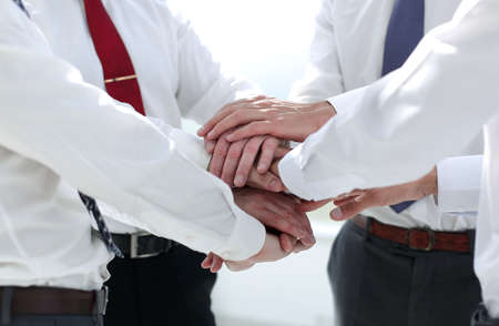 close up.employees of the company folded their hands togetherの写真素材