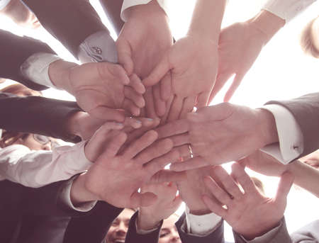 large business team is forming a circle and his hands clasped togetherの写真素材