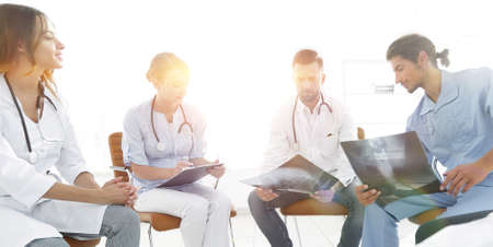 group of surgeons and medical professional staff discussing on patient radiographyの写真素材