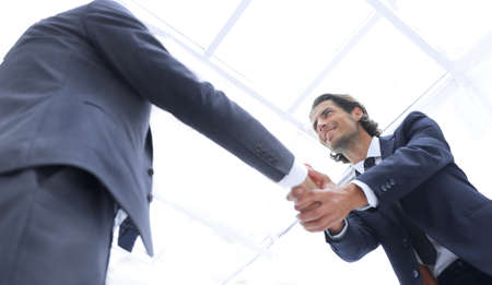 confident business people shaking hands