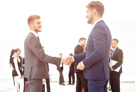handshake of business partners on the background of business teamの写真素材