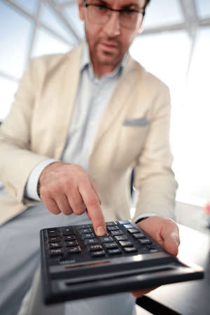 close up. businessman with calculator.の写真素材