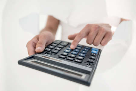 close up.the businessman uses the calculator.の写真素材