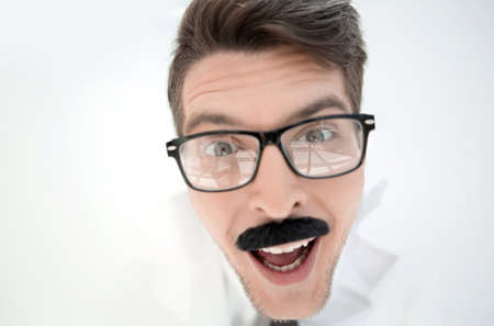 close up.attentive businessman with glasses looking at you