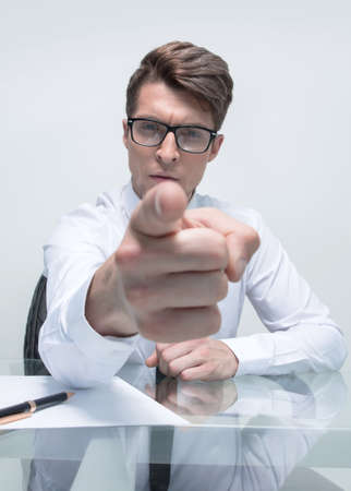 close up.businessman sitting at his Desk, pointing at youの写真素材