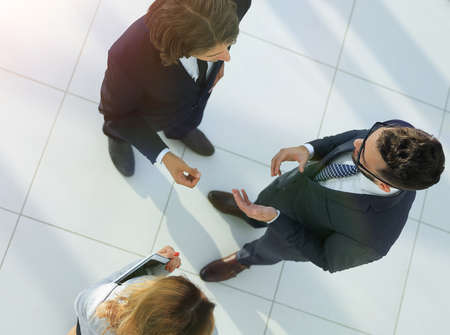 Group of coworkers discussing in conference roomの写真素材