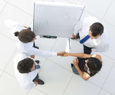 view from the top. the background image of a business handshake colleagues